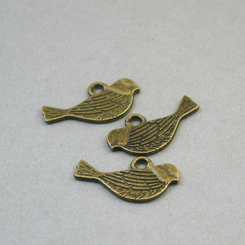 Bird charms, bird pendants. Two sided. Antique bronze 12X21mm CM1641B