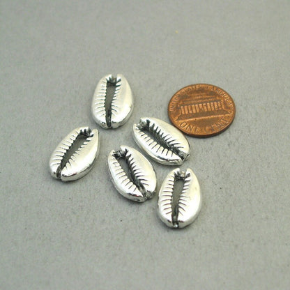 Shell charms, cowrie shell pendants. Two sided. Antique silver 12X19mm CM1859S