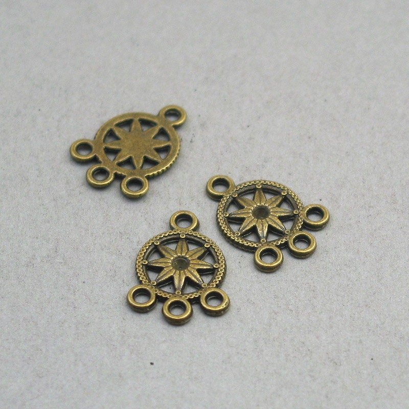 Star charm connectors, flower link pendants. One sided. Antique bronze 13X18mm CM1882B