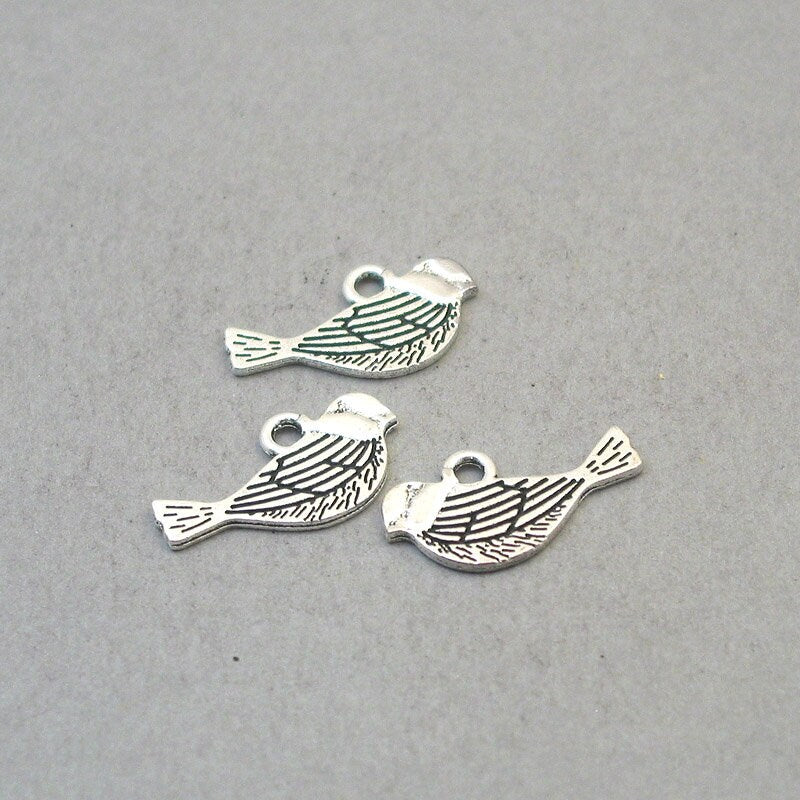 Bird charms, bird pendants. Two sided. Antique silver 12X21mm CM1641S